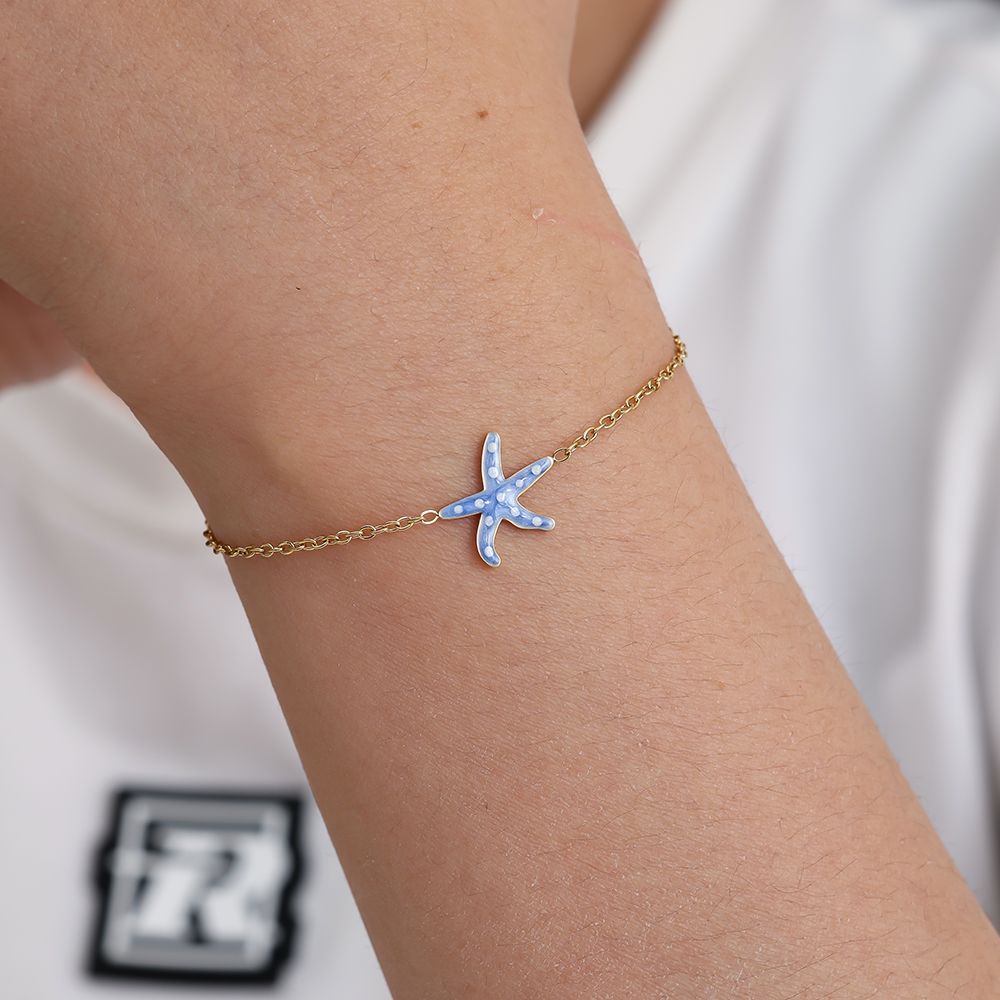 Zapestnica Blue Sea Star na zapestju - modra emajlirana morska zvezda z belimi pikami - kirurško jeklo 316L zlata pozlata