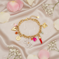 Zapestnica Many Nice Charms - flat lay z rožami - kirurško jeklo 316L zlata pozlata